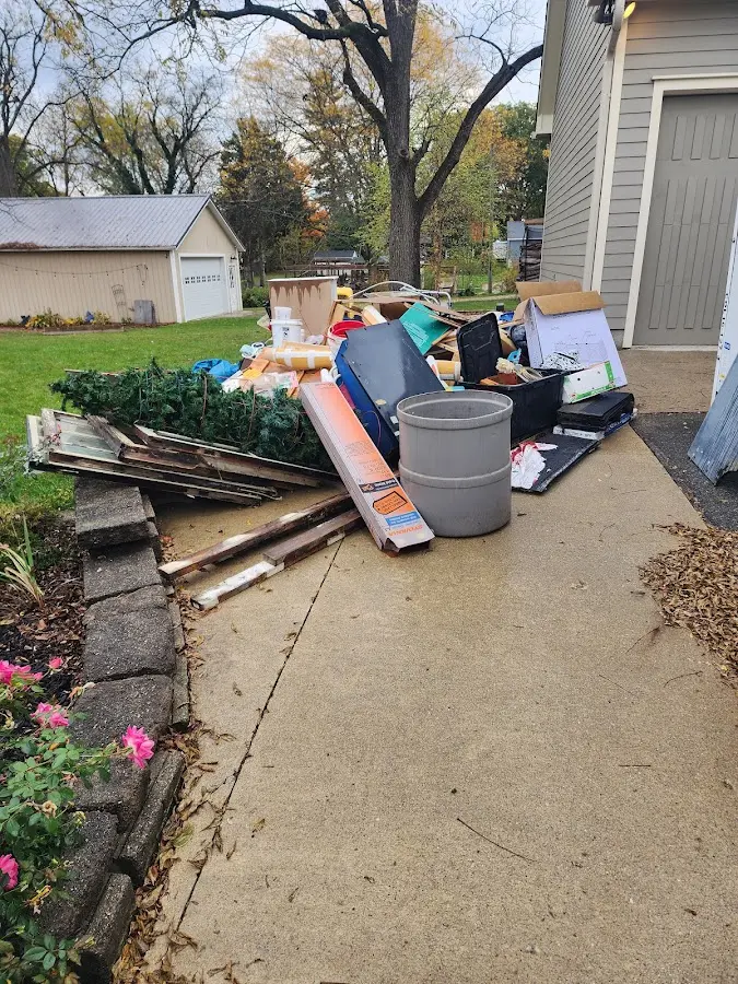 Dumpster being loaded with debris for Commercial Dumpster Rental in Tumwater